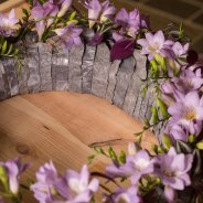 Funeral flower wreath with purple freesia