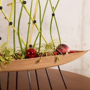an unusual base makes this arrangement stand out