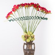 Classic and innovative vase design with red Freesia