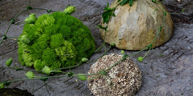 Serene funeral arrangement with Green Trick