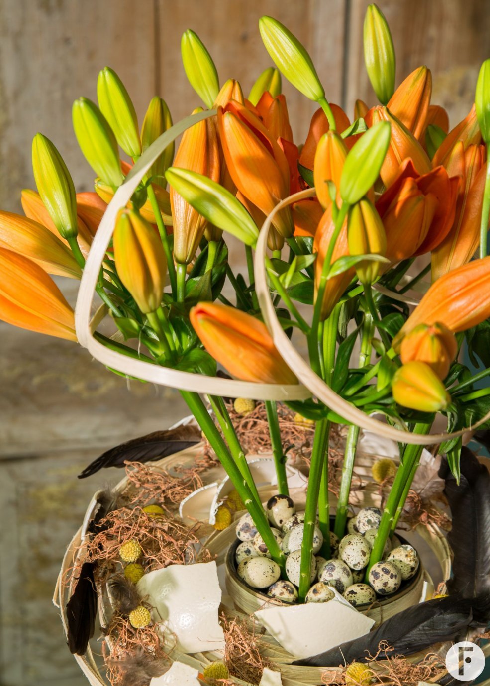 Orange Easter arrangement with Sunderland lilies - close-up