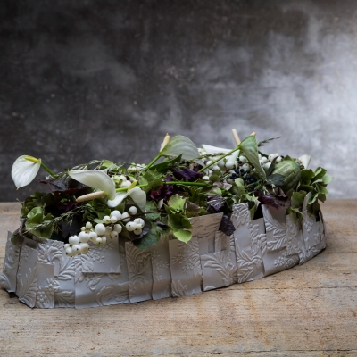 White funeral flower design with anthurium