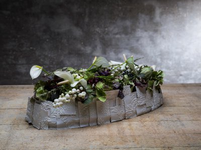 White funeral flower design with anthurium